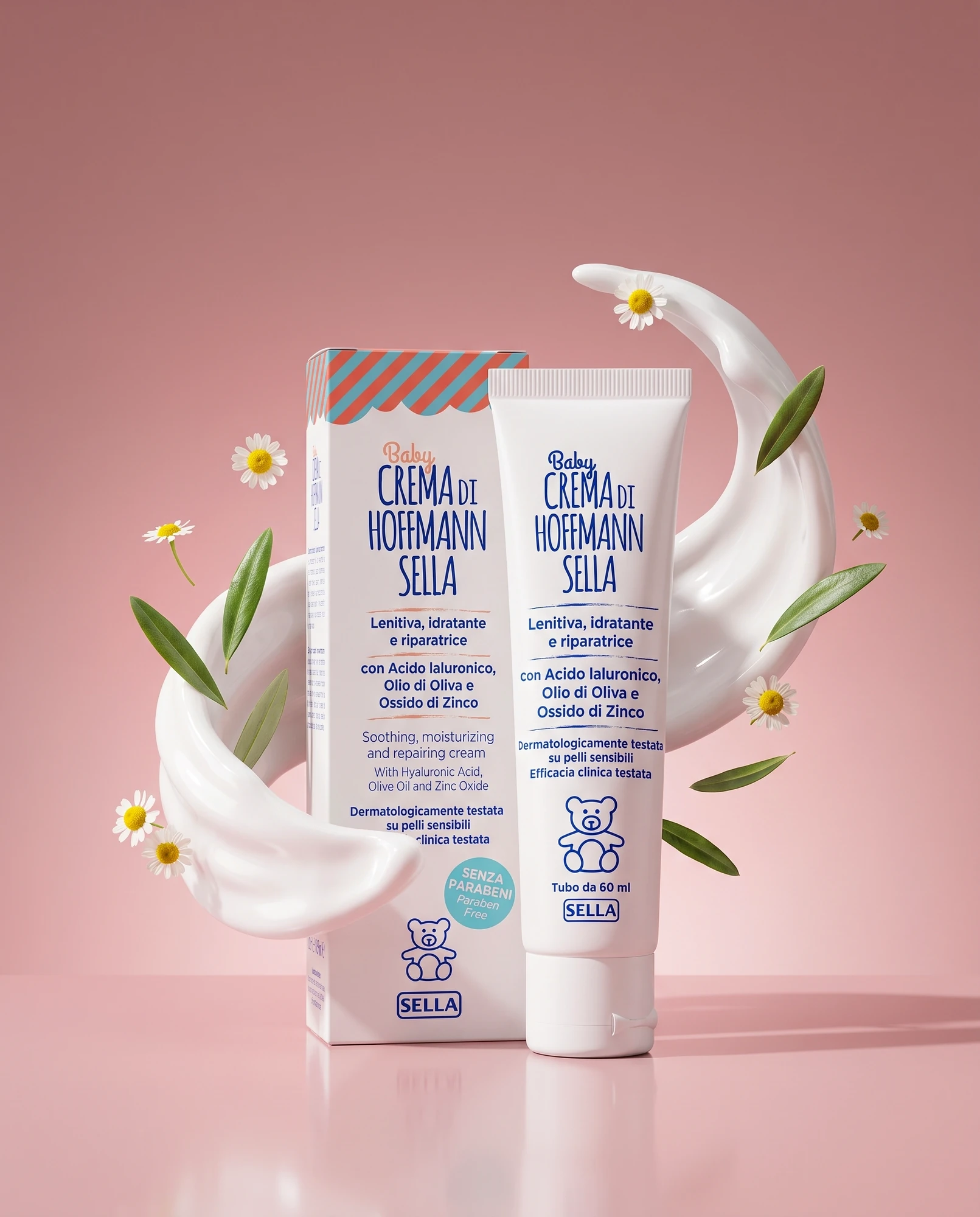 Tube and pack of Baby Crema di Hoffmann Sella with cream, daisies and olive leaves against a pink background