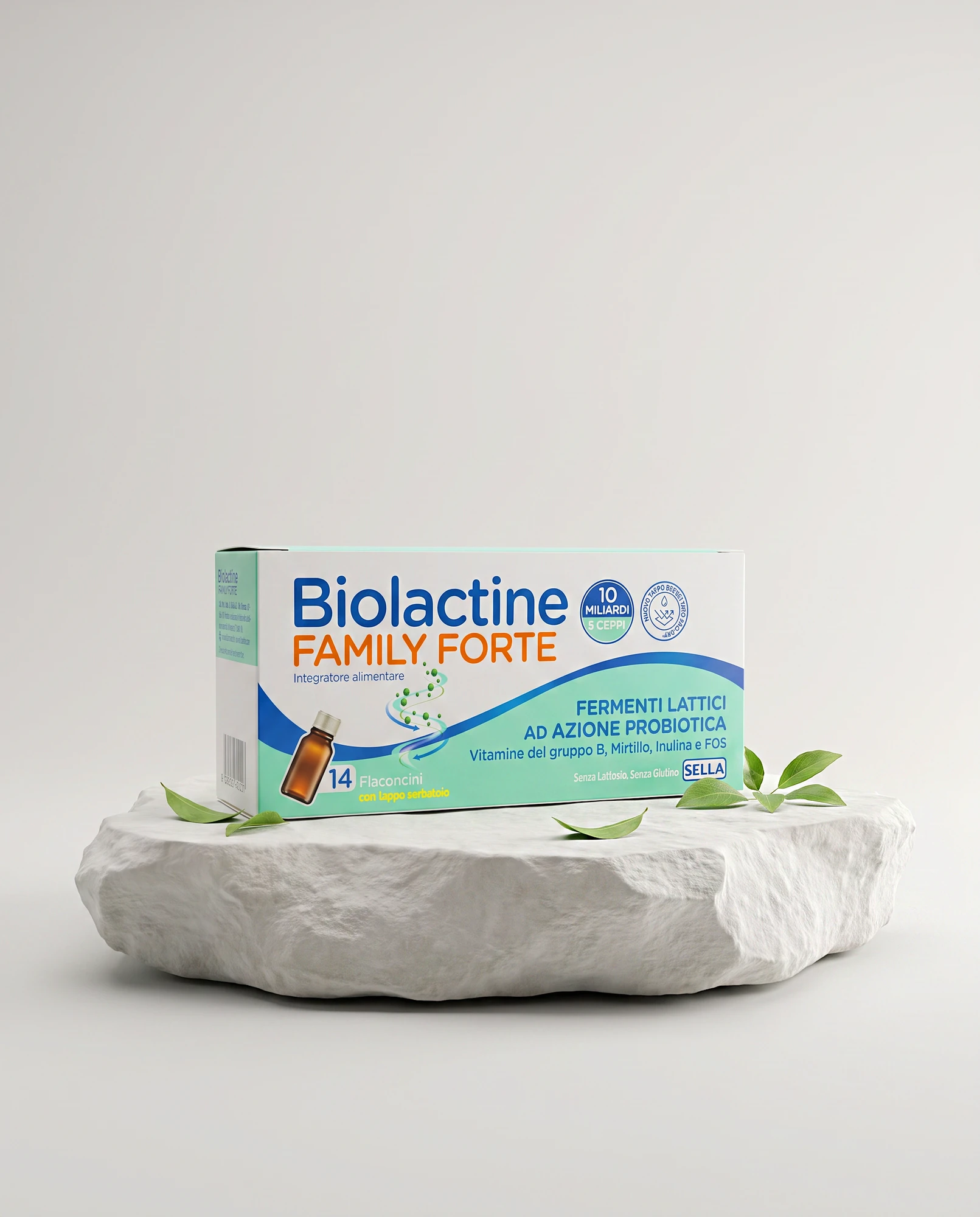 Pack of Biolactine Family Forte probiotics on white rock with green leaves