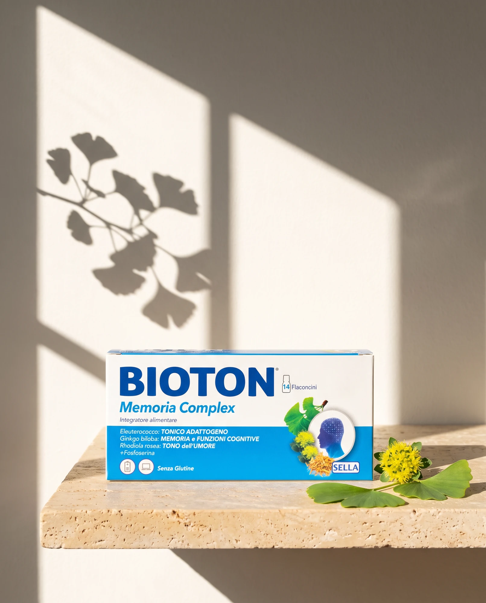 Pack of Bioton Memoria Complex on a travertine shelf with ginkgo leaves and the shadow of a plant