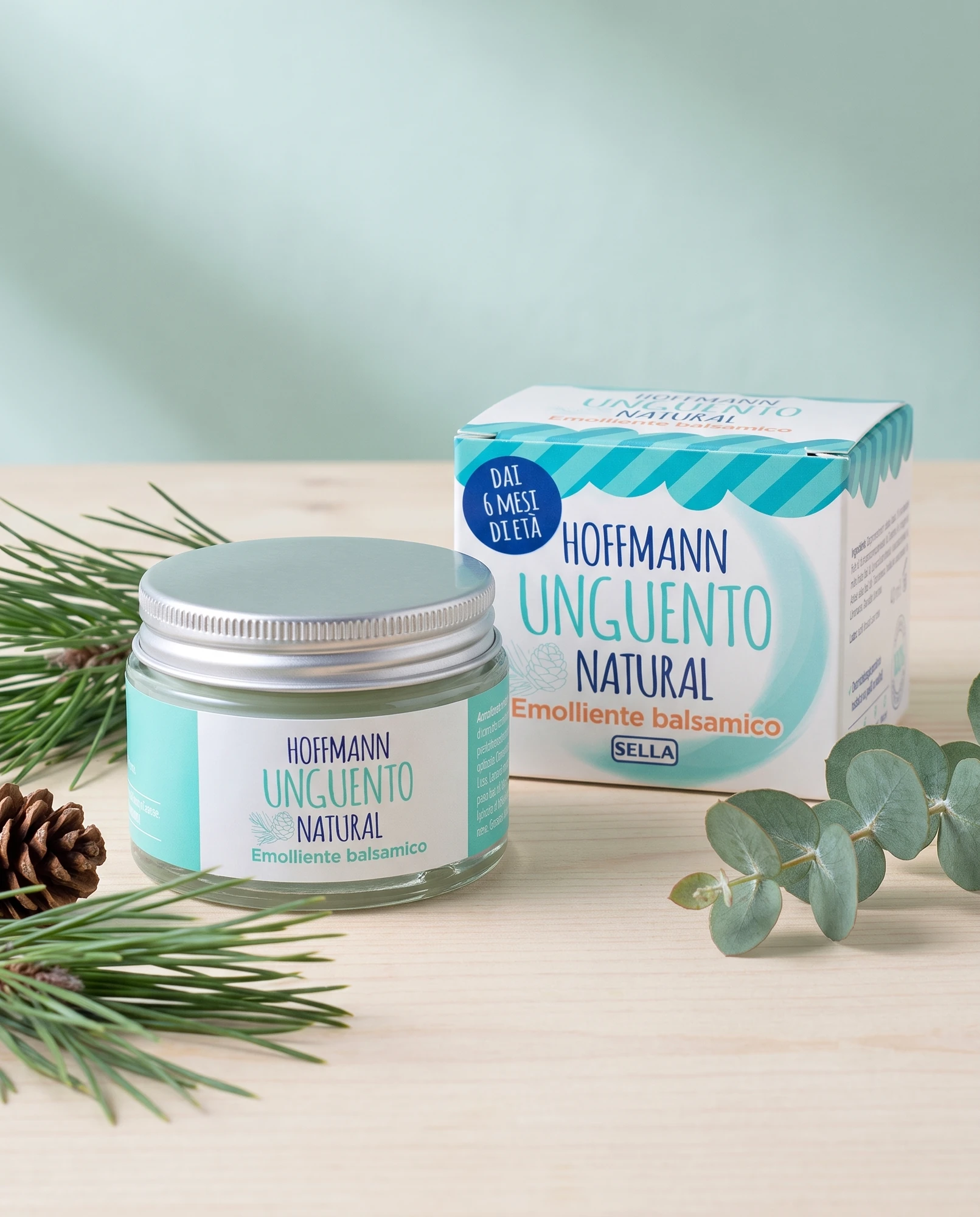 Jar and pack of Unguento Hoffmann Natural soothing balm with pine and eucalyptus sprigs